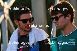 (L to R): Esteban Ocon (FRA) Alpine F1 Team with Lance Stroll (CDN) Aston Martin F1 Team on the drivers' parade. 22.09.2024. Formula 1 World Championship, Rd 18, Singapore Grand Prix, Marina Bay Street Circuit, Singapore, Race Day.