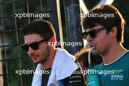 (L to R): Esteban Ocon (FRA) Alpine F1 Team with Lance Stroll (CDN) Aston Martin F1 Team on the drivers' parade. 22.09.2024. Formula 1 World Championship, Rd 18, Singapore Grand Prix, Marina Bay Street Circuit, Singapore, Race Day.