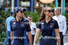 Sergio Perez (MEX) Red Bull Racing with Alice Hedworth (GBR) Red Bull Racing Communications Manager. 22.09.2024. Formula 1 World Championship, Rd 18, Singapore Grand Prix, Marina Bay Street Circuit, Singapore, Race Day.