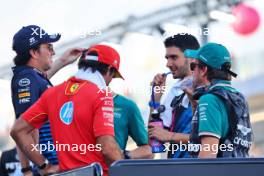 (L to R): Sergio Perez (MEX) Red Bull Racing; Carlos Sainz Jr (ESP) Ferrari; Esteban Ocon (FRA) Alpine F1 Team; and Fernando Alonso (ESP) Aston Martin F1 Team, on the drivers' parade. 22.09.2024. Formula 1 World Championship, Rd 18, Singapore Grand Prix, Marina Bay Street Circuit, Singapore, Race Day.