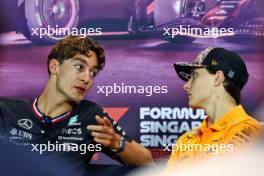 (L to R): George Russell (GBR) Mercedes AMG F1 and Oscar Piastri (AUS) McLaren in the FIA Press Conference. 19.09.2024. Formula 1 World Championship, Rd 18, Singapore Grand Prix, Marina Bay Street Circuit, Singapore, Preparation Day.