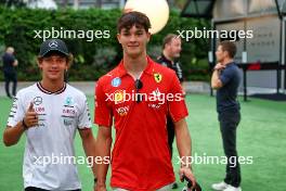 (L to R): Andrea Kimi Antonelli (ITA) Mercedes AMG F1 W15 Junior Driver with Oliver Bearman (GBR) Ferrari Reserve Driver. 19.09.2024. Formula 1 World Championship, Rd 18, Singapore Grand Prix, Marina Bay Street Circuit, Singapore, Preparation Day.