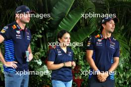 (L to R): Max Verstappen (NLD) Red Bull Racing with Hamda Al Qubaisi (UAE) MP Motorsport F1 Academy Driver; and Sergio Perez (MEX) Red Bull Racing. 19.09.2024. Formula 1 World Championship, Rd 18, Singapore Grand Prix, Marina Bay Street Circuit, Singapore, Preparation Day.