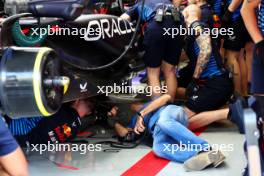 Adrian Newey (GBR) Red Bull Racing Chief Technical Officer looks under the Red Bull Racing RB20 of Sergio Perez (MEX) Red Bull Racing after he lifted a drain cover at turn 11. 23.02.2024. Formula 1 Testing, Sakhir, Bahrain, Day Three.