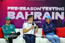 (L to R): Fernando Alonso (ESP) Aston Martin F1 Team; George Russell (GBR) Mercedes AMG F1; and Alexander Albon (THA) Williams Racing, in the FIA Press Conference. 22.02.2024. Formula 1 Testing, Sakhir, Bahrain, Day Two.
