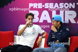 (L to R): George Russell (GBR) Mercedes AMG F1 and Alexander Albon (THA) Williams Racing in the FIA Press Conference. 22.02.2024. Formula 1 Testing, Sakhir, Bahrain, Day Two.