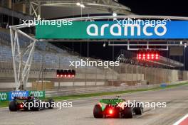 George Russell (GBR) Mercedes AMG F1 W15 and Zhou Guanyu (CHN) Sauber C44. 21.02.2024. Formula 1 Testing, Sakhir, Bahrain, Day One.