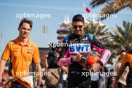 (L to R): Oscar Piastri (AUS) McLaren and Esteban Ocon (FRA) Alpine F1 Team. 21.02.2024. Formula 1 Testing, Sakhir, Bahrain, Day One.
