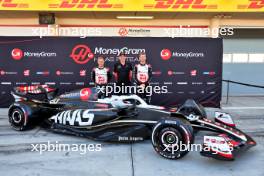(L to R): Kevin Magnussen (DEN) Haas F1 Team; Karsten Pedersen, MoneyGram Fan, and Nico Hulkenberg (GER) Haas VF-24. 21.02.2024. Formula 1 Testing, Sakhir, Bahrain, Day One.