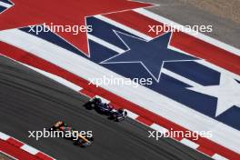 Lando Norris (GBR) McLaren MCL38 and Liam Lawson (NZL) RB VCARB 01. 18.10.2024. Formula 1 World Championship, Rd 19, United States Grand Prix, Austin, Texas, USA, Sprint Qualifying Day