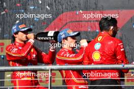 (L to R): Second placed Carlos Sainz Jr (ESP) Ferrari and race winner Charles Leclerc (MON) Ferrari on the podium with Ravin Jain (GBR) Ferrari Strategy Director. 20.10.2024. Formula 1 World Championship, Rd 19, United States Grand Prix, Austin, Texas, USA, Race Day.