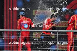 (L to R): Race winner Charles Leclerc (MON) Ferrari celebrates with Ravin Jain (GBR) Ferrari Strategy Director and Carlos Sainz Jr (ESP) Ferrari on the podium. 20.10.2024. Formula 1 World Championship, Rd 19, United States Grand Prix, Austin, Texas, USA, Race Day.