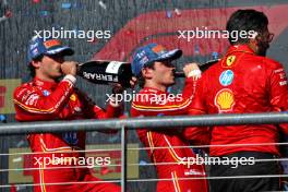 (L to R): Carlos Sainz Jr (ESP) Ferrari celebrates his second position on the podium with race winner Charles Leclerc (MON) Ferrari and Ravin Jain (GBR) Ferrari Strategy Director. 20.10.2024. Formula 1 World Championship, Rd 19, United States Grand Prix, Austin, Texas, USA, Race Day.