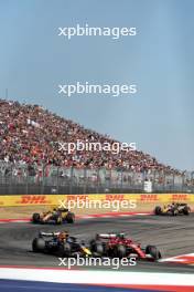 Max Verstappen (NLD) Red Bull Racing RB20 and Carlos Sainz Jr (ESP) Ferrari SF-24 battle for position. 20.10.2024. Formula 1 World Championship, Rd 19, United States Grand Prix, Austin, Texas, USA, Race Day.