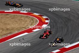 Max Verstappen (NLD) Red Bull Racing RB20 and Carlos Sainz Jr (ESP) Ferrari SF-24 battle for position. 20.10.2024. Formula 1 World Championship, Rd 19, United States Grand Prix, Austin, Texas, USA, Race Day.