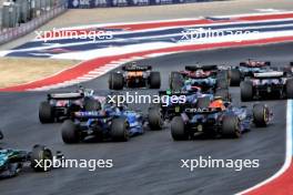 Sergio Perez (MEX) Red Bull Racing RB20 and Franco Colapinto (ARG) Williams Racing FW46 at the start of Sprint. 19.10.2024. Formula 1 World Championship, Rd 19, United States Grand Prix, Austin, Texas, USA, Sprint and Qualifying Day.