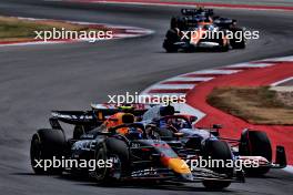 Sergio Perez (MEX) Red Bull Racing RB20 and Yuki Tsunoda (JPN) RB VCARB 01 battle for position. 19.10.2024. Formula 1 World Championship, Rd 19, United States Grand Prix, Austin, Texas, USA, Sprint and Qualifying Day.