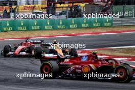 Lando Norris (GBR) McLaren MCL38 battle for position with Charles Leclerc (MON) Ferrari SF-24 behind Carlos Sainz Jr (ESP) Ferrari SF-24. 19.10.2024. Formula 1 World Championship, Rd 19, United States Grand Prix, Austin, Texas, USA, Sprint and Qualifying Day.