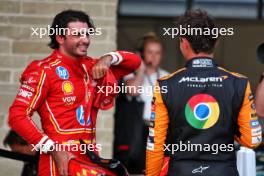 (L to R): third placed Carlos Sainz Jr (ESP) Ferrari in qualifying parc ferme with pole sitter Lando Norris (GBR) McLaren. 19.10.2024. Formula 1 World Championship, Rd 19, United States Grand Prix, Austin, Texas, USA, Sprint and Qualifying Day.