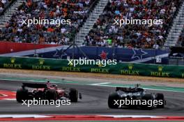 George Russell (GBR) Mercedes AMG F1 W15 and Carlos Sainz Jr (ESP) Ferrari SF-24 battle for position. 19.10.2024. Formula 1 World Championship, Rd 19, United States Grand Prix, Austin, Texas, USA, Sprint and Qualifying Day.