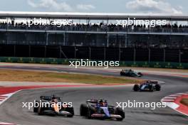 Oscar Piastri (AUS) McLaren MCL38 and Yuki Tsunoda (JPN) RB VCARB 01 battle for position. 19.10.2024. Formula 1 World Championship, Rd 19, United States Grand Prix, Austin, Texas, USA, Sprint and Qualifying Day.