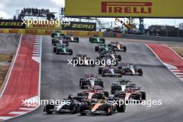 George Russell (GBR) Mercedes AMG F1 W15 and Lando Norris (GBR) McLaren MCL38 battle for position at the start of Sprint. 19.10.2024. Formula 1 World Championship, Rd 19, United States Grand Prix, Austin, Texas, USA, Sprint and Qualifying Day.