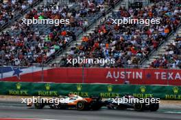 Lando Norris (GBR) McLaren MCL38 and George Russell (GBR) Mercedes AMG F1 W15 battle for position. 19.10.2024. Formula 1 World Championship, Rd 19, United States Grand Prix, Austin, Texas, USA, Sprint and Qualifying Day.