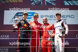 The podium (L to R): Josep Maria Marti (ESP) Campos Racing, second; Oliver Bearman (GBR) Prema Racing, race winner; Paul Aron (EST) Hitech Pule-Eight, third. 29.06.2024. FIA Formula 2 Championship, Rd 7, Sprint Race, Spielberg, Austria, Saturday.