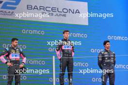The podium (L to R): Kush Maini (IND) Invicta Racing, second; Victor Martins (FRA) ART Grand Prix, race winner; Juan Manuel Correa (USA) Dams, third. 22.06.2024. FIA Formula 2 Championship, Rd 6, Sprint Race, Barcelona, Spain, Saturday.