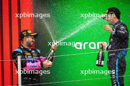 Second placed Kush Maini (IND) Invicta Racing celebrates on the podium with third placed Juan Manuel Correa (USA) Dams. 22.06.2024. FIA Formula 2 Championship, Rd 6, Sprint Race, Barcelona, Spain, Saturday.