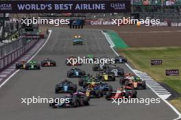 Victor Martins (FRA) ART Grand Prix leads at the start of the race. 07.07.2024. FIA Formula 2 Championship, Rd 8, Feature Race, Silverstone, England, Sunday.