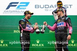 (L to R): Kush Maini (IND) Invicta Racing celebrates his second position on the podium with third placed Kush Maini (IND) Invicta Racing. 20.07.2024. FIA Formula 2 Championship, Rd 9, Budapest, Hungary, Sprint Race, Saturday.