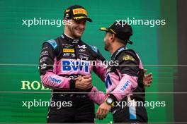 (L to R): Victor Martins (FRA) ART Grand Prix celebrates his third position on the podium with second placed Kush Maini (IND) Invicta Racing. 20.07.2024. FIA Formula 2 Championship, Rd 9, Budapest, Hungary, Sprint Race, Saturday.