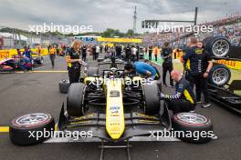 Kush Maini (IND) Invicta Racing on the grid. 21.07.2024. FIA Formula 2 Championship, Rd 9, Budapest, Hungary, Feature Race, Sunday.