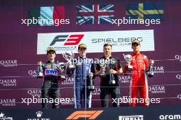 The podium (L to R): Gabriele Mini (ITA) Prema Racing, second; Luke Browning (GBR) Hitech Pulse-Eight, race winner; Dino Beganovic (SWE) Prema Racing, third. 30.06.2024. FIA Formula 3 Championship, Rd 6, Feature Race, Spielberg, Austria, Sunday.