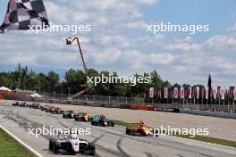 Race winner Mari Boya (ESP) Campos Racing takes the chequered flag at the end of the race. 22.06.2024. FIA Formula 3 Championship, Rd 5, Sprint Race, Barcelona, Spain, Saturday.