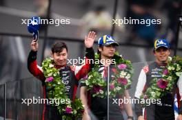 Jose Maria Lopez (ARG) / Kamui Kobayashi (JPN) / Nyck de Vries (NLD) #07 Toyota Gazoo Racing, celebrate second position on the podium. 16.06.2024. FIA World Endurance Championship, Round 4, Le Mans 24 Hours, Race, Le Mans, France, Sunday.