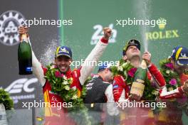 Race winners Antonio Fuoco (ITA) / Miguel Molina (ESP) / Nicklas Nielsen (DEN) #50 Ferrari AF Corse, celebrate on the podium. 16.06.2024. FIA World Endurance Championship, Round 4, Le Mans 24 Hours, Race, Le Mans, France, Sunday.