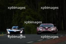 Dries Vanthoor (BEL) / Raffaele Marciello (ITA) / Marco Wittmann (GER) #15 BMW M Team WRT BMW M Hybrid V8 and Sarah Bovy (BEL) / Rahel Frey (SUI) / Michelle Gatting (DEN) #85 Iron Dames Lamborghini Huracan LMGT3 Evo2. 15.06.2024. FIA World Endurance Championship, Round 4, Le Mans 24 Hours, Race, Le Mans, France, Saturday.