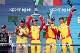 Race winners Yifei Ye (CHN), Robert Shwartzman (ISR), and Robert Kubica (POL) #83 AF Corse Ferrari celebrate on the podium. 01.09.2024. FIA World Endurance Championship, Rd 6, Lone Star COTA, Circuit of the Americas, Austin, Texas, USA.