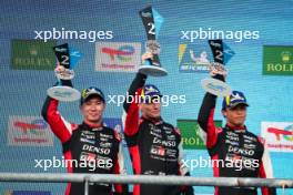 Kamui Kobayashi (JPN), Mike Conway (GBR) and Nyck de Vries (NLD) #07 Toyota Gazoo Racing, celebrate second position on the podium. 01.09.2024. FIA World Endurance Championship, Rd 6, Lone Star COTA, Circuit of the Americas, Austin, Texas, USA.