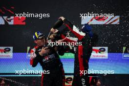 Race winners Sebastien Buemi (SUI) / Brendon Hartley (NZL) / Ryo Hirakawa (JPN) #08 Toyota Gazoo Racing, celebrate on the podium. 02.11.2024. FIA World Endurance Championship, Round 8, Eight Hours of Bahrain, Sakhir, Bahrain, Saturday.