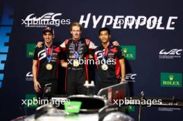 (L to R): Sebastien Buemi (SUI) / Brendon Hartley (NZL) / Ryo Hirakawa (JPN) #08 Toyota Gazoo Racing, Toyota GR010, Hybrid, celebrate pole position in parc ferme. 01.11.2024. FIA World Endurance Championship, Round 8, Eight Hours of Bahrain, Sakhir, Bahrain, Friday.