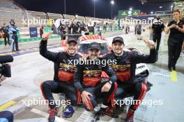 (L to R): Andre Lotterer (GER),  Laurens Vanthoor (BEL) and Kevin Estre (FRA) #06 Porsche Penske Motorsport, Porsche 963, celebrate becoming WEC Champions in parc ferme. 02.11.2024. FIA World Endurance Championship, Round 8, Eight Hours of Bahrain, Sakhir, Bahrain, Saturday.