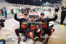 (L to R): Andre Lotterer (GER),  Laurens Vanthoor (BEL) and Kevin Estre (FRA) #06 Porsche Penske Motorsport, Porsche 963, celebrate becoming WEC Champions in parc ferme. 02.11.2024. FIA World Endurance Championship, Round 8, Eight Hours of Bahrain, Sakhir, Bahrain, Saturday.